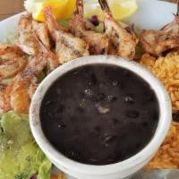 Camarones Rancheros · Tender shrimp sauteed with fresh onions, bell peppers and tomatoes, then simmered in our del...