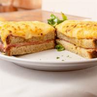 Le Croque Monsieur · The most popular Parisian sandwich consists of two layers of toasted country bread, layers o...