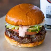 Stand Burger · Grilled onions, lettuce, tomato, pickles, and stand burger sauce.