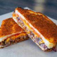 Short Rib Grilled Cheese · Double parmesan crusted sourdough, braised beef short rib, triple cheddar, bacon tomato jam,...