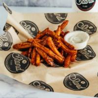 Fire Fries · Well done fries tossed in fire sauce.