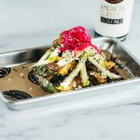 Brussels Sprouts · Green apple, pickled red onion, lemon sesame vinaigrette, sesame seeds, and feta cheese.