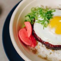 Chicken Longanisa · Sweet cured ground chicken, garlic rice, fried egg, red radish, and scallions.