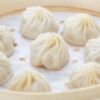 Juicy Pork Dumplings (Xiao Long Bao) · (8pcs.) Steamed dumplings filled w/ pork and soup