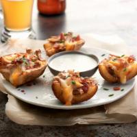 Loaded Skins · Gluten sensitive. Bacon, Jack, Cheddar cheese, chive dip.