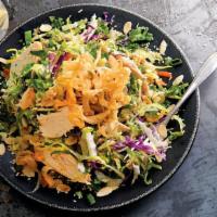 Asian Grilled Chicken Salad · Grilled chicken with crunchy noodles, almonds, sesame seeds, green onions, carrots and cilan...