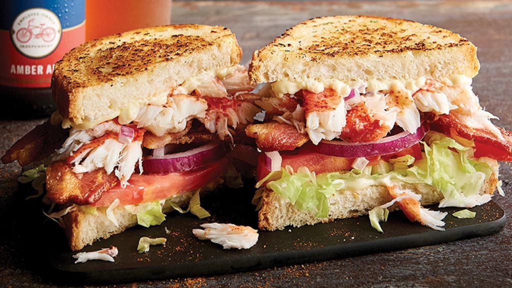 Lobster Blt · Lobster claw meat, smoked bacon, sliced tomatoes, shredded lettuce and mayo on grilled Parmesan bread.