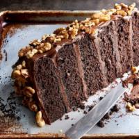 Chocolate Motherlode Cake · Six decadent layers of chocolate cake and rich fudge icing, topped with walnuts. Featured on...