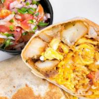 The Ranchero Burrito · chorizo, organic scrambled eggs, country potato,  pico de gallo, cilantro, cheddar, flour to...