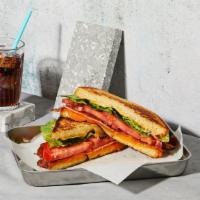 The Blt · Melted Cheddar cheese with bacon, lettuce, tomato and mayonnaise grilled between two slices ...