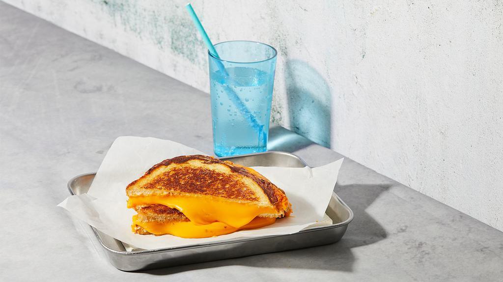 The Classic · Melted American cheese grilled between two slices of buttered bread.