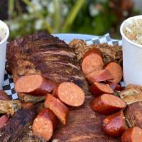 Sampler For Four · Lots of food. Comes with KCBBQ's slow smoked meats, fries and rings, plus choice of two pint...
