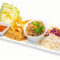 Thai Lettuce Cups · Wok-seared minced chicken with Thai spices, served with bean sprout, wonton strips, cool let...