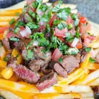 Galbi Fries · thin & crispy fries, nacho cheese, galbi, pico de gallo & cilantro