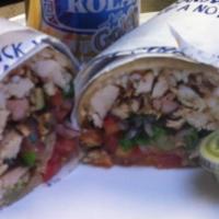 Chicken In A Wrap · Includes lettuce, cucumber salad, hummus and white sauce and hot sauce.