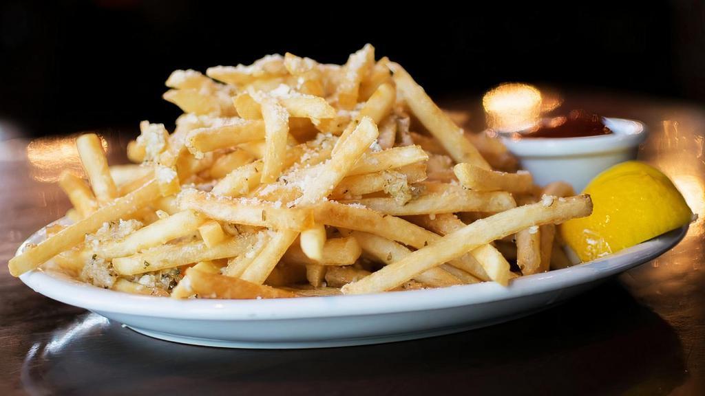 Greek Fries · Shoestring fries tossed with fresh garlic, oregano, olive oil, grated parmesan and fresh squeezed lemon.