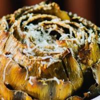 Baked Artichoke · Whole artichoke, doused with lemony caesar sauce and topped with fresh parmesan cheese.