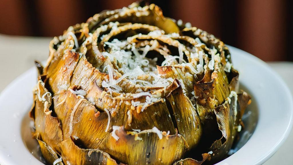 Baked Artichoke · Whole artichoke, doused with lemony caesar sauce and topped with fresh parmesan cheese.