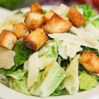 Caesar, Large · Romaine lettuce, shaved parmesan and homemade croutons.