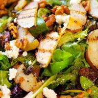 Grilled Pear, Small · Fresh grilled pear, goat cheese and candied walnuts on a bed of fresh greens. Served with ou...