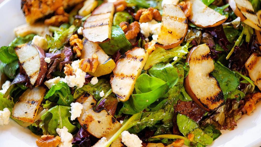 Grilled Pear, Medium · Fresh grilled pear, goat cheese and candied walnuts on a bed of fresh greens. Served with our balsamic vinaigrette and garlic focaccia bread.