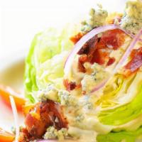 Wedge · Iceberg wedge, house-made blue cheese dressing, blue cheese crumbles, bacon, red onion, grap...