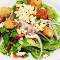 Spinach, Large · Fresh spinach, crumbled bacon, crumbled egg, red onion,  homemade spinach dressing and homem...