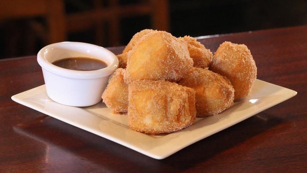 Big Easy Beignets · New Orleans style dough, deep fried and coated in your choice of powdered sugar or cinnamon sugar. Served with raspberry, chocolate and house caramel sauce.