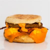 English Muffin, Bacon, Sausage, Egg, & Cheddar Sandwich · 2 scrambled eggs, melted Cheddar cheese, smoked bacon, breakfast sausage, and Sriracha aioli...