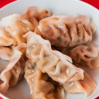 8 Pack Dumplings · Steamed with your choice of filling between Ginger Chicken and Green Vegetable.