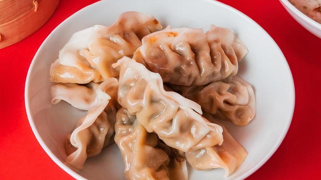 8 Pack Dumplings · Steamed with your choice of filling between Ginger Chicken and Green Vegetable.
