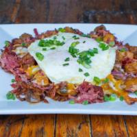 Corned Beef Hash · Home-made corned beef, two eggs any style and grilled onions. Topped with jack, cheddar and ...