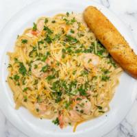 Shrimp Pasta · Seasoned grilled shrimp in a creamy alfredo sauce and your choice of spaghetti or fettuccine.