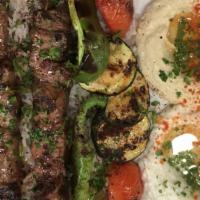 Lamb Kabob Plate · Gluten Free. 2 Skewers of Lamb, Onions, Green Pepper, and Tomatoes.