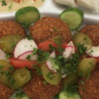 Falafel Plate · Vegan, Gluten Free, vegetarian. Six pieces of falafel on a bed of lettuce with fresh tomato,...