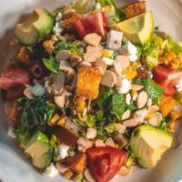 Chicken Avocado Salad · Romaine and red leaf lettuce, roasted corn, goat cheese, almonds, dates, tomatoes, avocado, ...