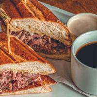 Prime Rib French Dip · Gruyere cheese, creamy horseradish and au jus with choice of rosemary parmesan frites or a s...