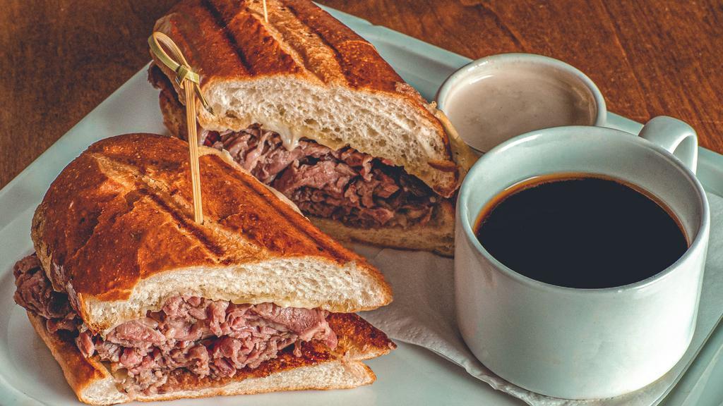 Prime Rib French Dip · Gruyere cheese, creamy horseradish and au jus with choice of rosemary parmesan frites or a side salad