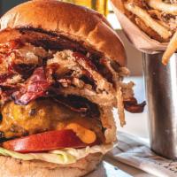 Bbq American Kobe Burger · Smokey bacon, crispy onion strings and tangy BBQ sauce with rosemary parmesan frites or side...