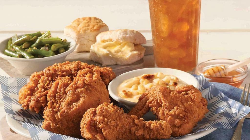 Southern Fried Chicken · Four pieces of bone-in fried chicken with honey, served with two Country Sides and Buttermilk Biscuits or Corn Muffins..