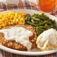 Country Fried Steak · USDA Choice steak fried and topped with Sawmill Gravy. Served with your choice of 2 or 3 Cou...