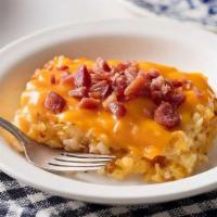 Loaded Hashbrown Casserole · Our Hashbrown Casserole grilled and topped with Colby Cheese, and bacon pieces..
