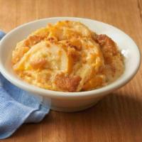 Three Cheese Squash Casserole · Baked yellow squash with a creamy cheese blend, topped with breadcrumbs.