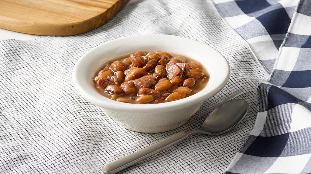 Pinto Beans · Pinto Beans slow simmered with a hint of pork seasoning..