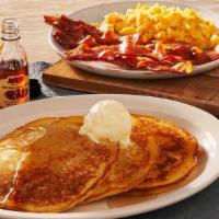 Momma'S Pancake Breakfast® · Three Buttermilk Pancakes topped with butter and served with two eggs. Plus Thick-Sliced Bac...
