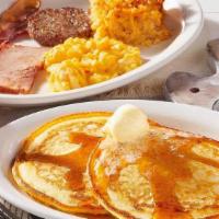 Grandma'S Sampler · Two Buttermilk Pancakes n’ butter served with two eggs* and a sampling of Thick-Sliced Bacon...