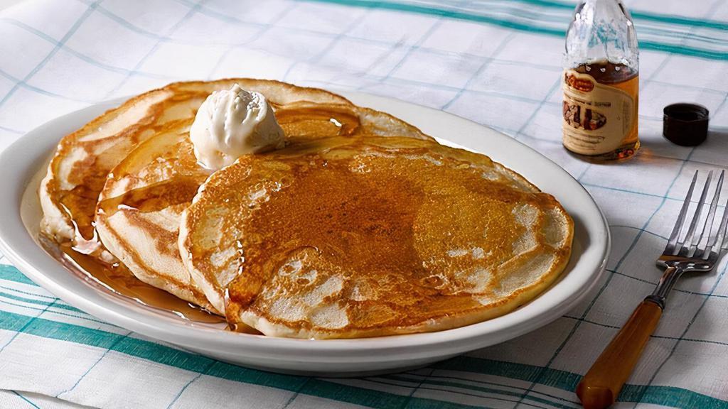 Buttermilk Pancakes With 100% Pure Natural Syrup · Enjoy three golden Buttermilk Pancakes n’ butter. Plus 100% Pure Natural Syrup..