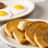 Momma'S French Toast Breakfast® · Four slices of our Sourdough bread, hand-dipped in eggs and grilled, topped with butter and ...
