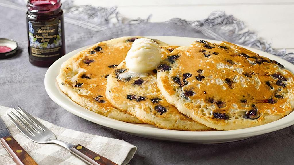 Wild Maine Blueberry Pancakes · Three Buttermilk Pancakes n’ butter filled with Wild Maine Blueberries. Plus our Blueberry Syrup..