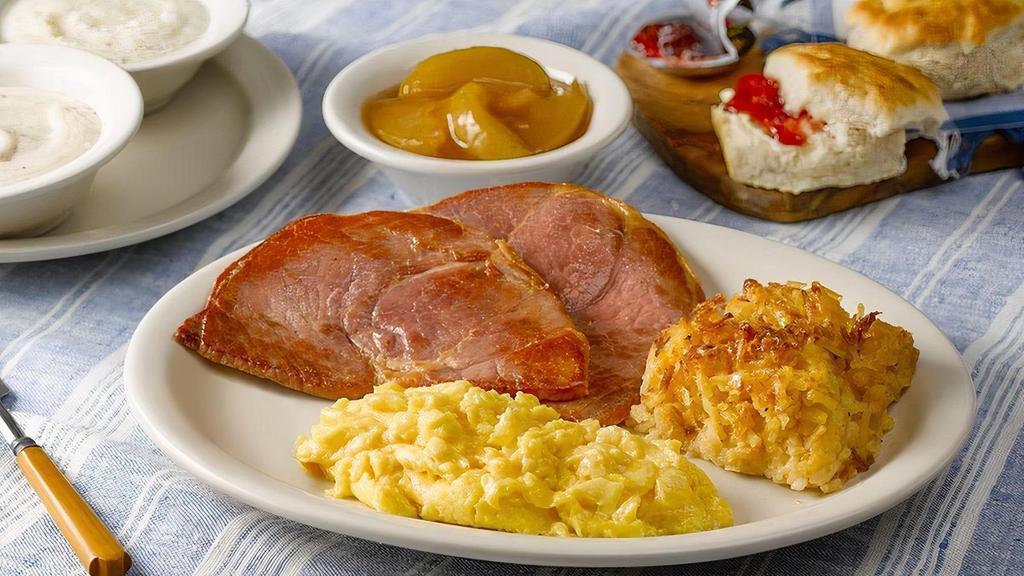 The Cracker Barrel'S Country Boy Breakfast® · Starts with three farm fresh eggs*, Fried Apples, Hashbrown Casserole, and grits. Plus Sirloin Steak*, Sugar Cured or Country Ham (350-540 cal). Comes with Buttermilk Biscuits (160 cal each) and Sawmill Gravy (160 cal)..